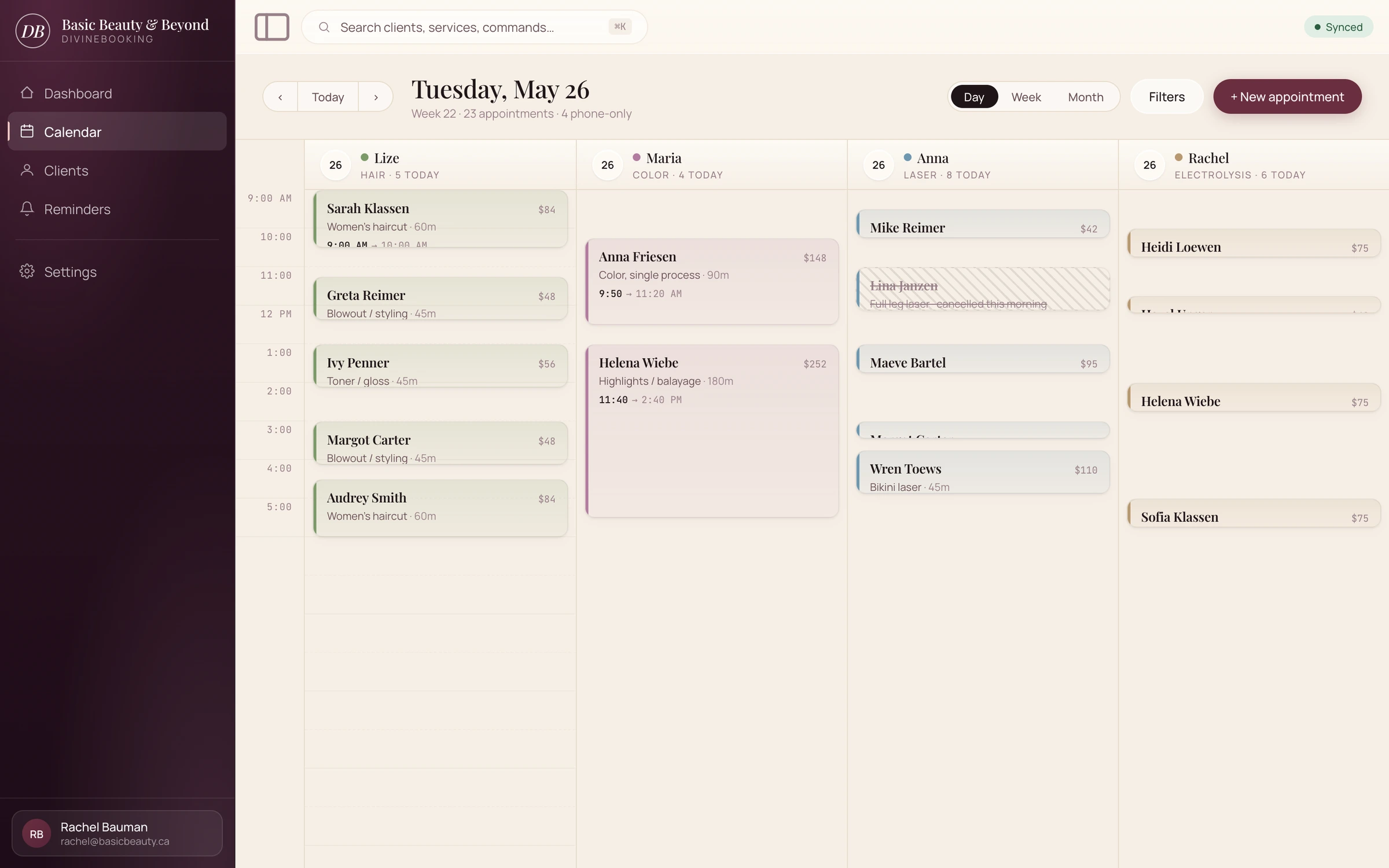 DivineBooking day calendar with staff columns colour-coded